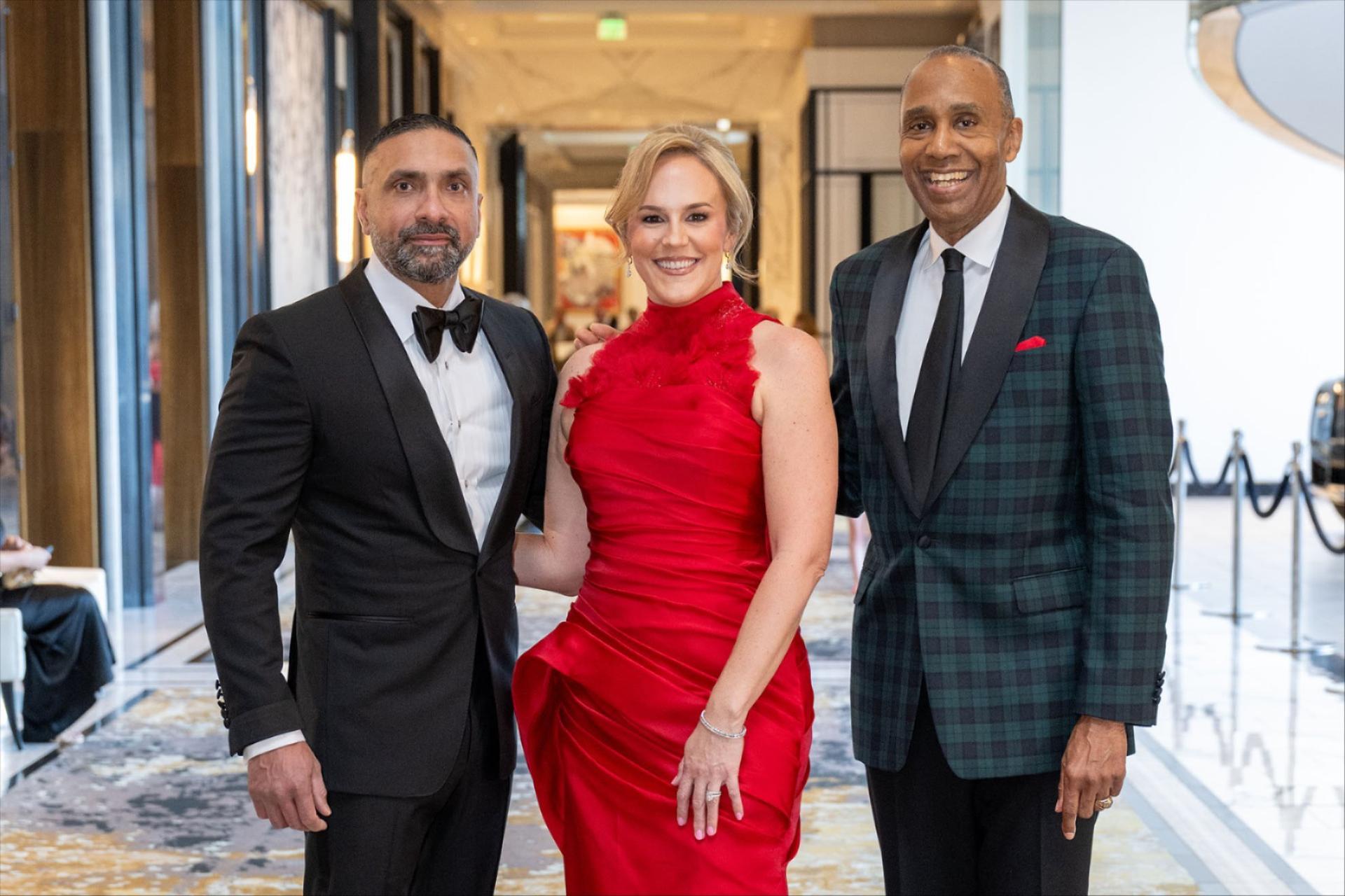 Image of 2026 UH Law Gala Co-Chairs Mo (J.D. ’04) and Erin Aziz with UHLC Dean Leonard M. Baynes (L to R). posing for a photo.