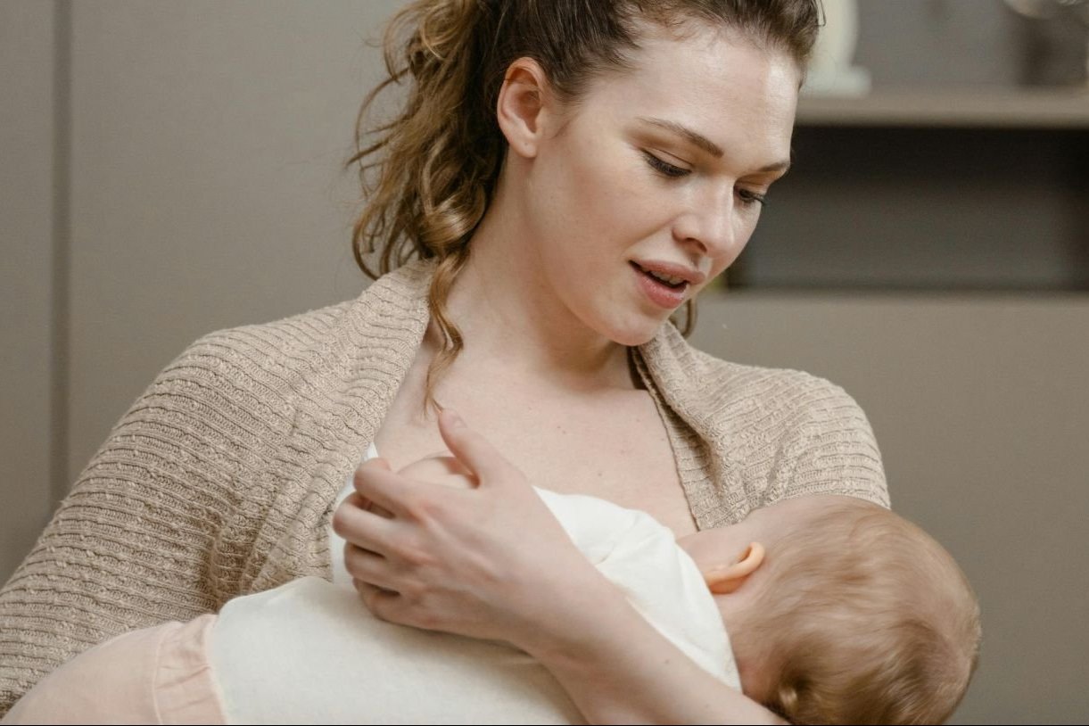 Image of a woman holding a baby.