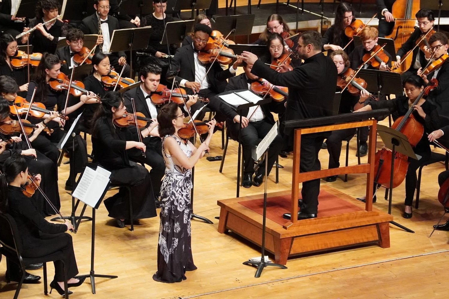 A group of people playing instruments on a stage.