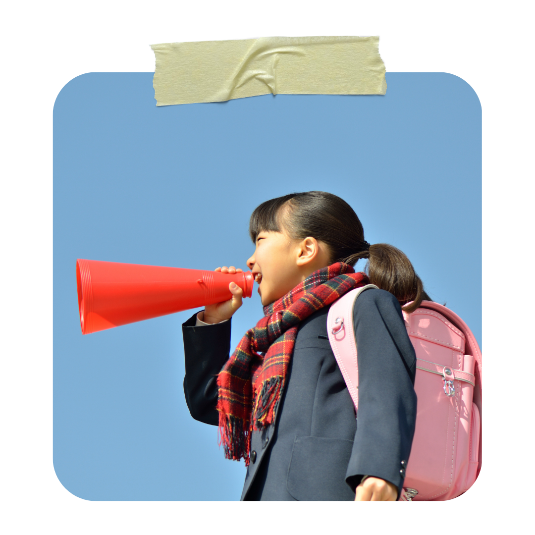Japanese elementary school girl wearing a pink randoseru backpack